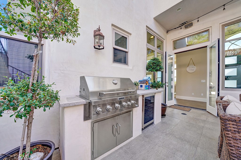 75 Marbella San Clemente, CA 92673 - Photo 29 of 54 a kitchen with a stove and a potted plant
