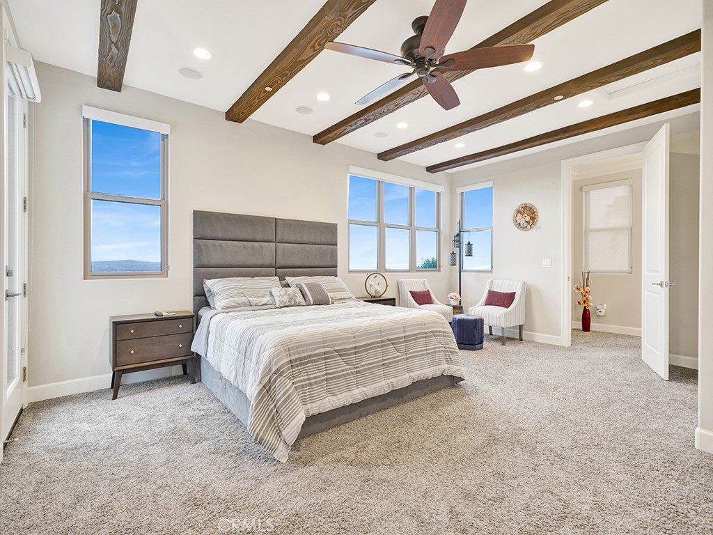 75 Marbella San Clemente, CA 92673 - Photo 36 of 54 a bedroom with bed and a chandelier