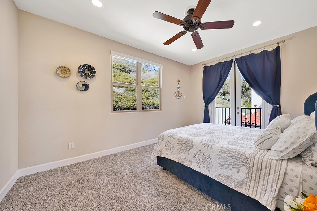 75 Marbella San Clemente, CA 92673 - Photo 44 of 54 a bedroom with a bed and a window