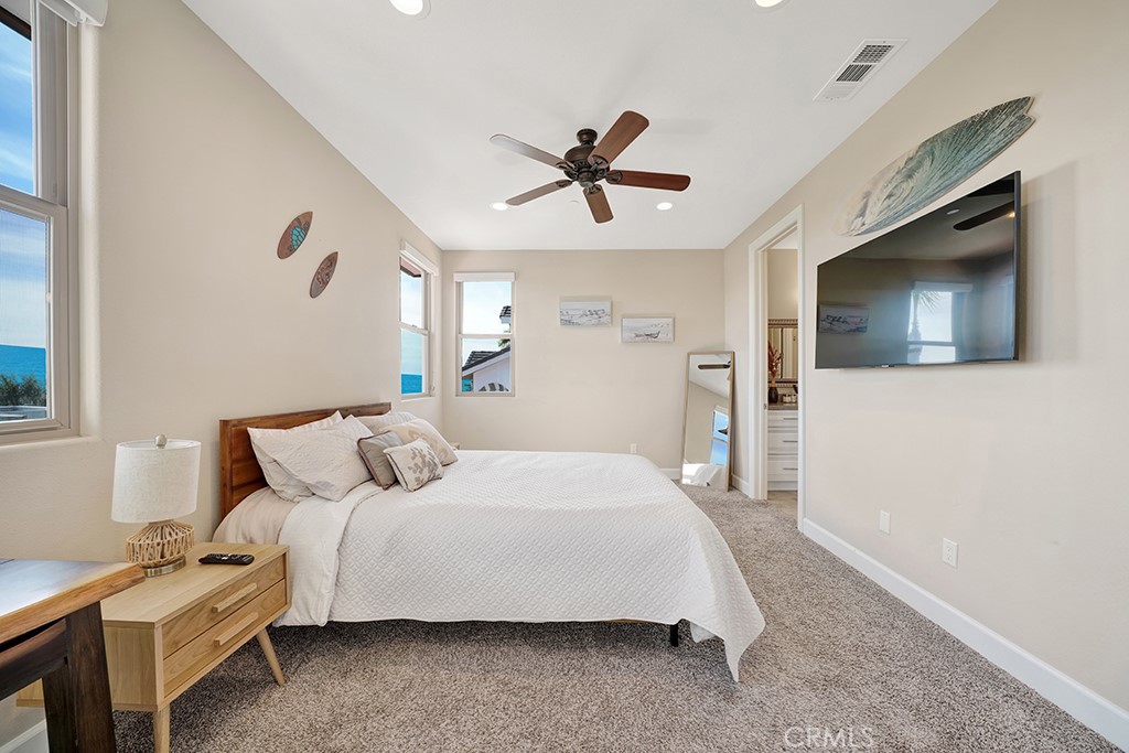 75 Marbella San Clemente, CA 92673 - Photo 46 of 54 a bedroom with a bed and a flat screen tv