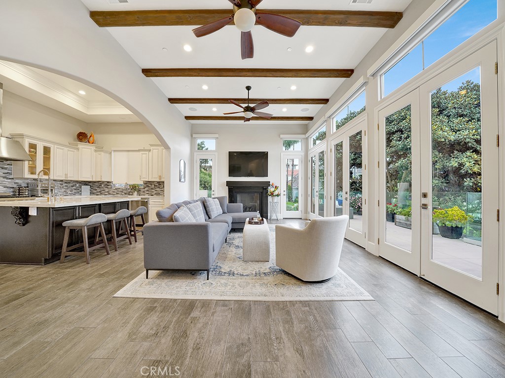 75 Marbella San Clemente, CA 92673 - Photo 10 of 54 a living room with furniture a flat screen tv and a floor to ceiling window