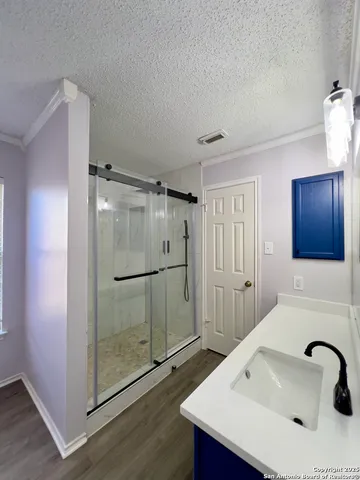 a bathroom with a sink and a mirror