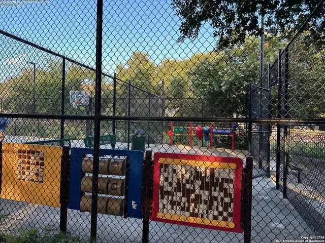 a view of a park with swings