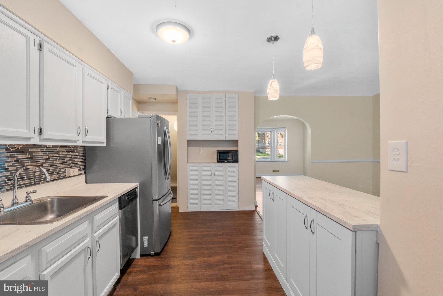 1917 Ramblewood Road Baltimore, MD 21239 - Photo 8 of 22 Breakfast Bar With Pendant Lights