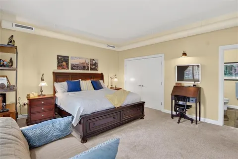 a bedroom with a bed and furniture