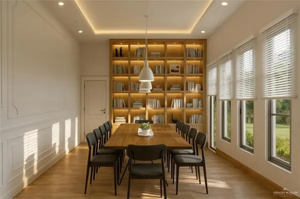 a view of a house with pool lawn chairs and a dining table