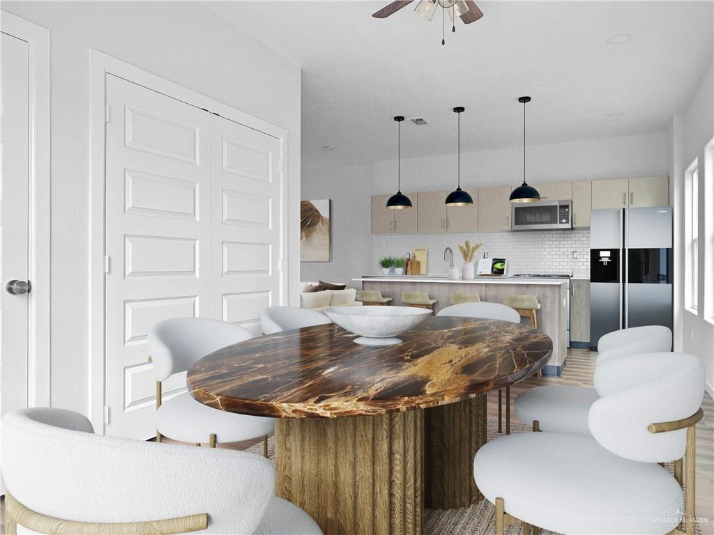 4804 Tyler, Unit 3 McAllen, TX 78503 - Photo 4 of 30 a kitchen with a table chairs and a wooden floor