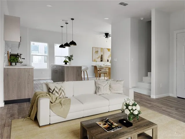 a kitchen with a table and chairs