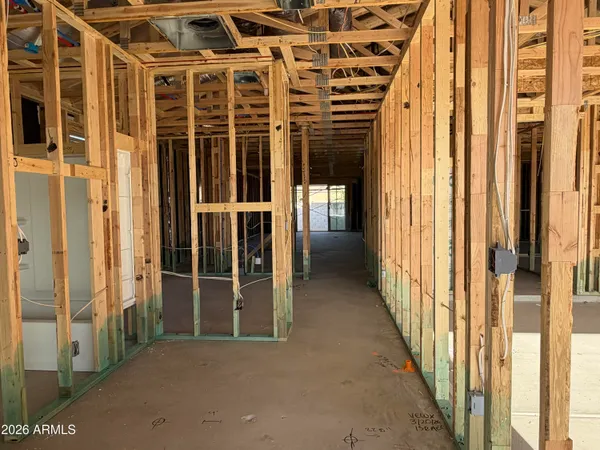 a view of a porch with wooden floor and windows