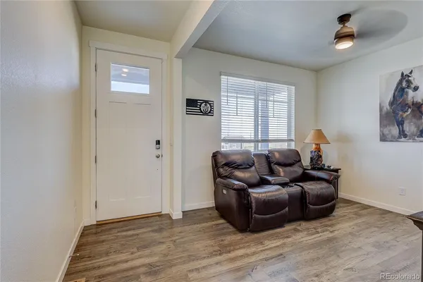 a living room with furniture and a window