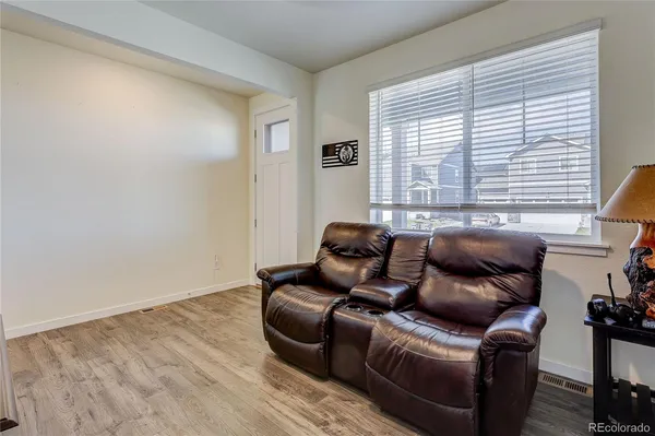 a living room with furniture and a window