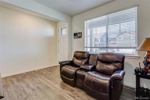 a living room with furniture and a window