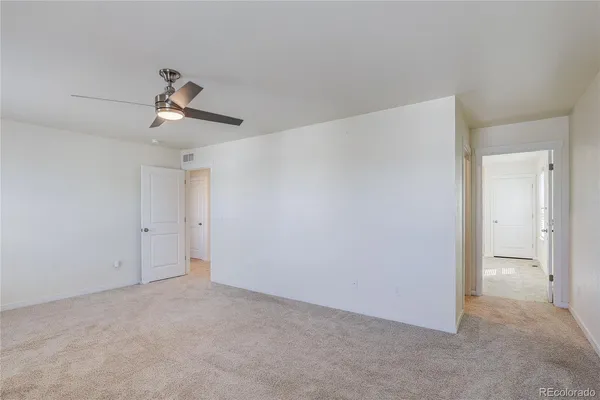 a view of a chandelier fan in a room