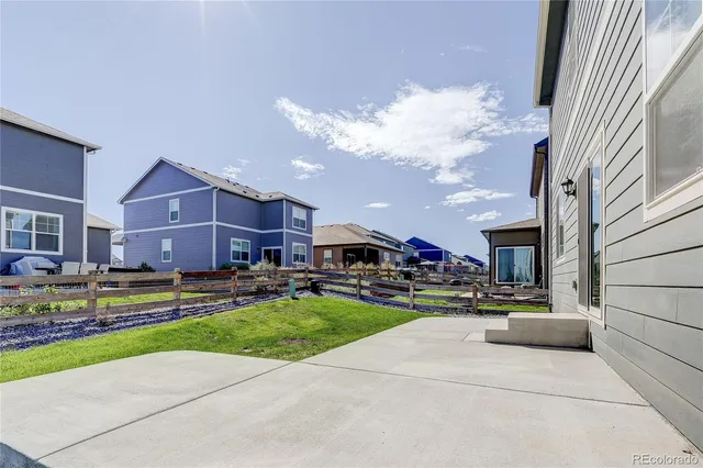 a view of a building with a yard and entertaining space