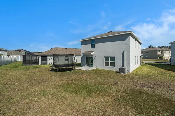 a view of a house with backyard