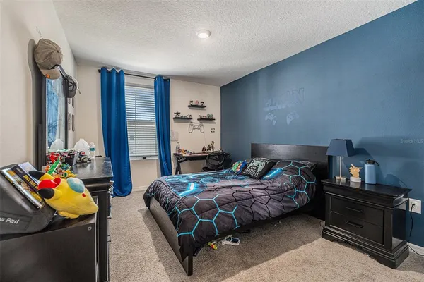 a bedroom with bed and a closet
