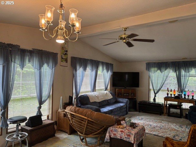 56399 Christopher Road Bandon, OR 97411 - Photo 11 of 34 a living room with furniture a chandelier and a flat screen tv