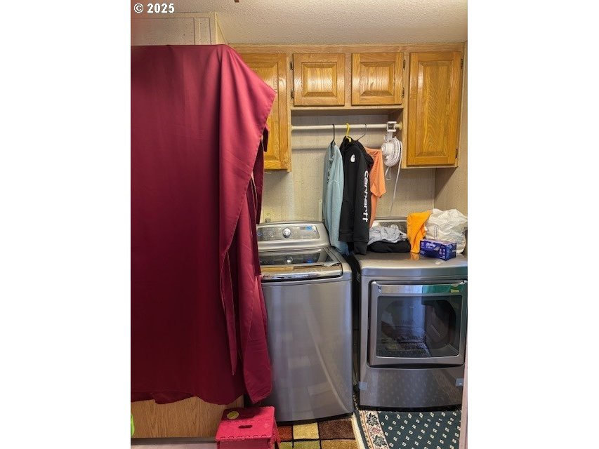 56399 Christopher Road Bandon, OR 97411 - Photo 17 of 34 a kitchen with a refrigerator and cabinets