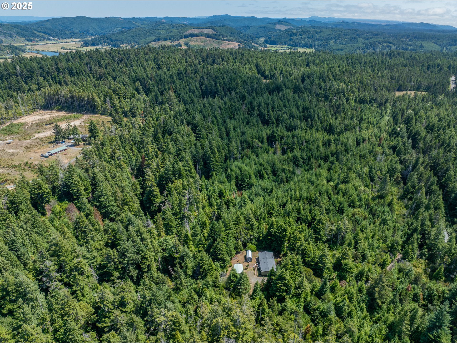 56399 Christopher Road Bandon, OR 97411 - Photo 31 of 34 an aerial view of residential house with outdoor space and trees all around