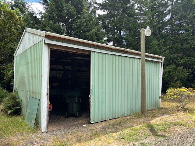 56399 Christopher Road Bandon, OR 97411 - Photo 4 of 34 a view of a house with backyard