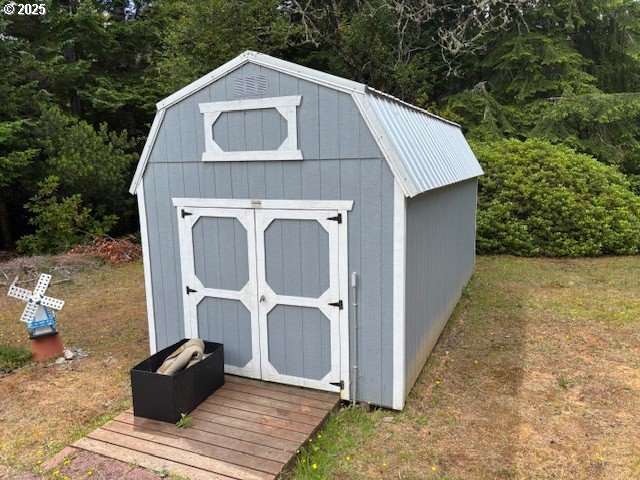 56399 Christopher Road Bandon, OR 97411 - Photo 5 of 34 a view of a house with a yard