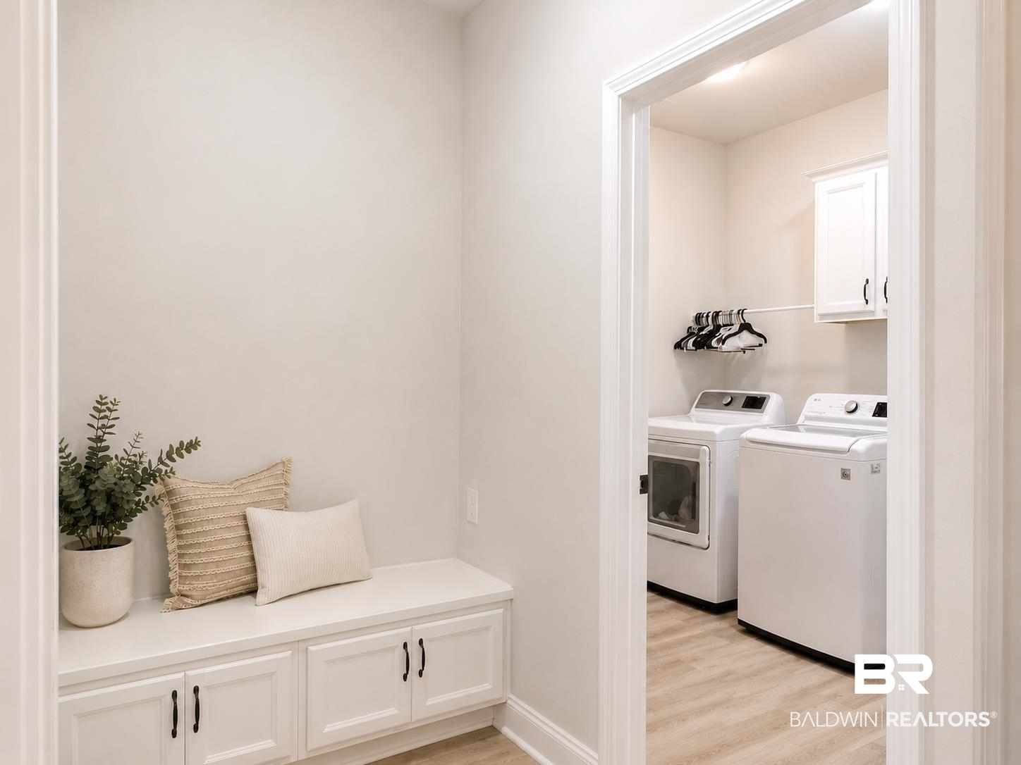 1097 Stella Road Foley, AL 36535 - Photo 12 of 15 Dedicated laundry area featuring a light-toned wood-finish floor and white cabinetry