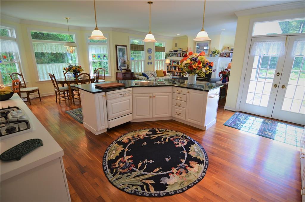275 Ward Hill Road Unity, ME 04988 - Photo 6 of 34 Kitchen island overlooks family room