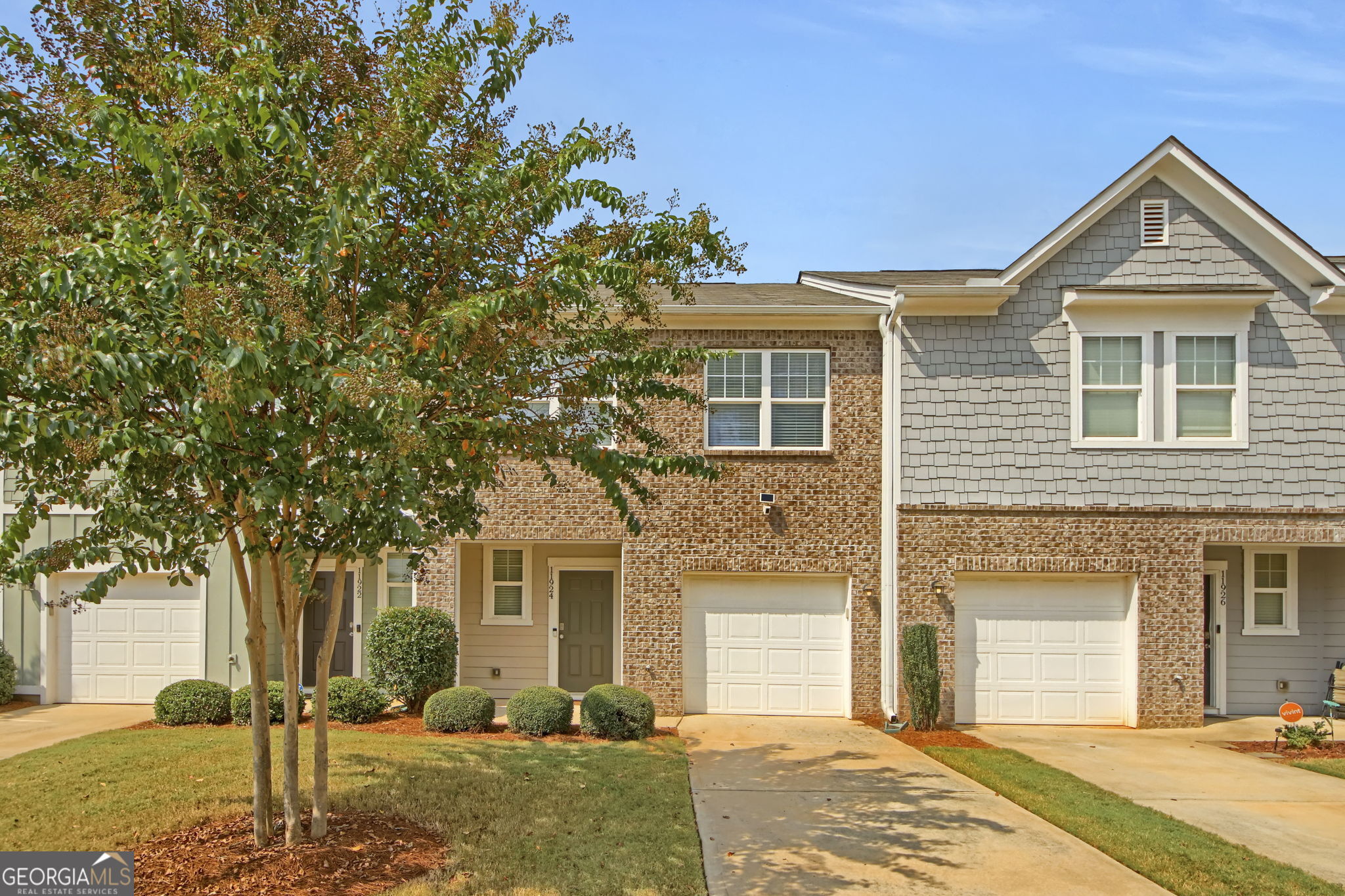 a front view of a house with a yard