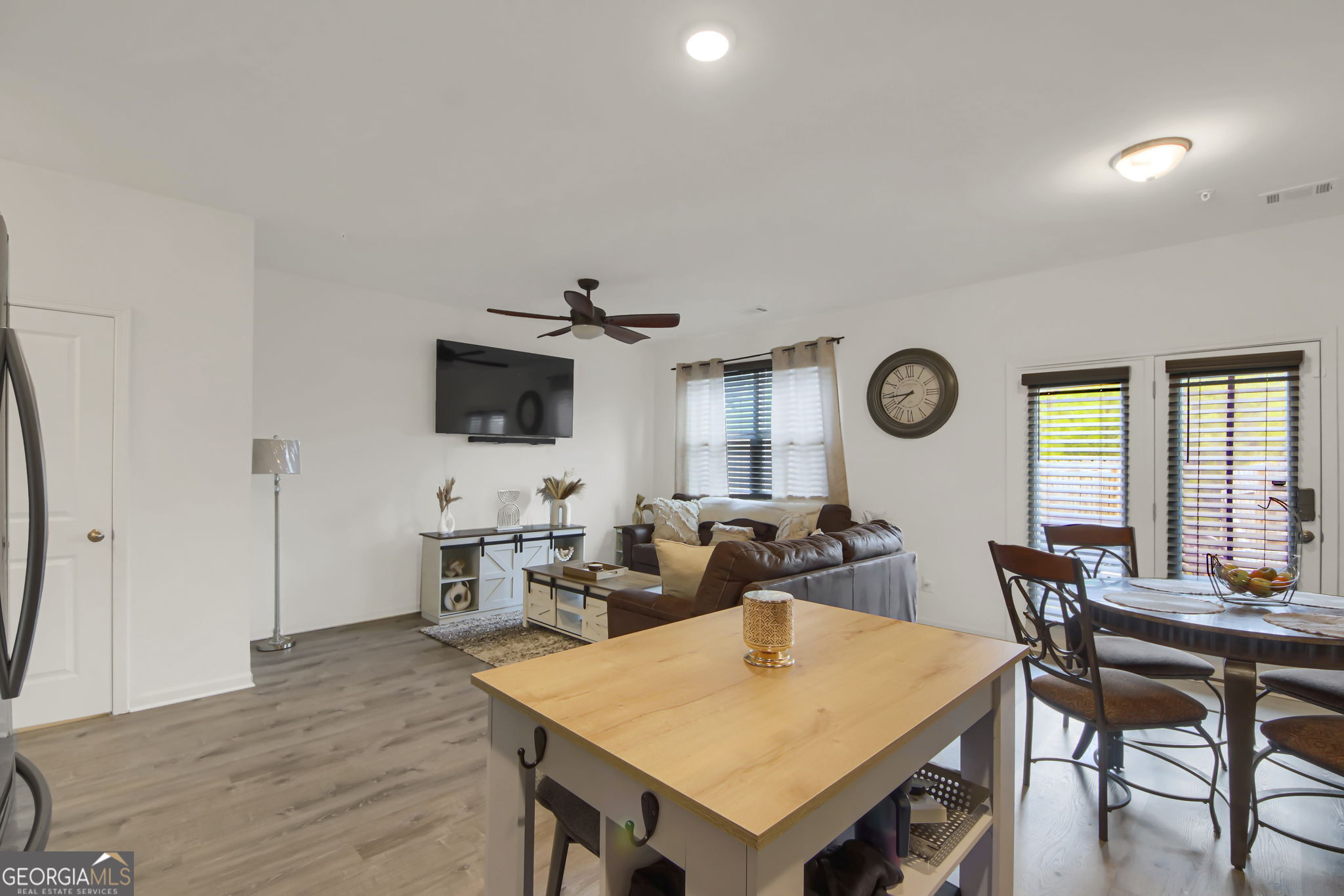 11924 Fuller Street Hampton, GA 30228 - Photo 14 of 26 a view of a dining room with furniture and wooden floor