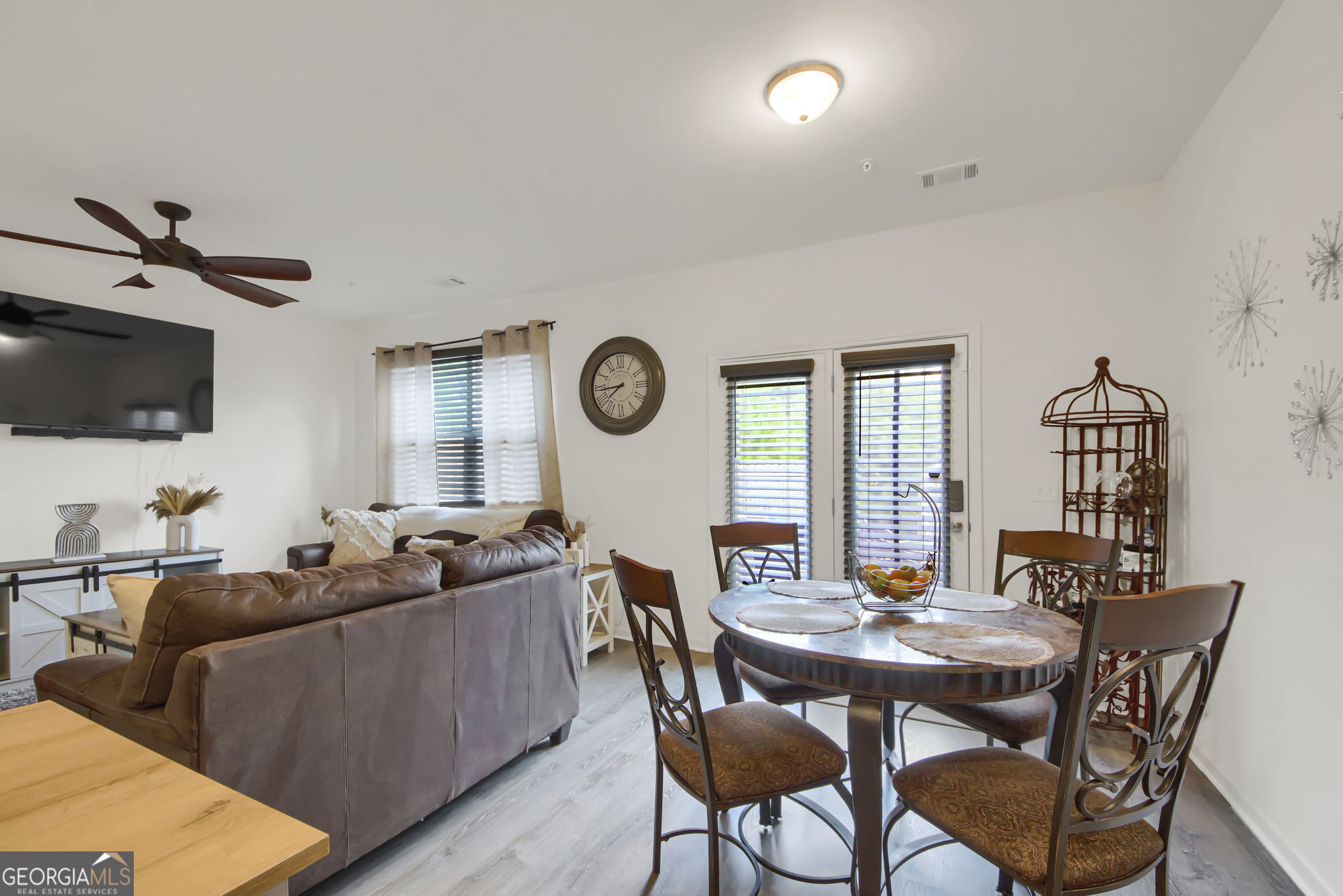 11924 Fuller Street Hampton, GA 30228 - Photo 15 of 26 a view of a dining room with furniture and a large window