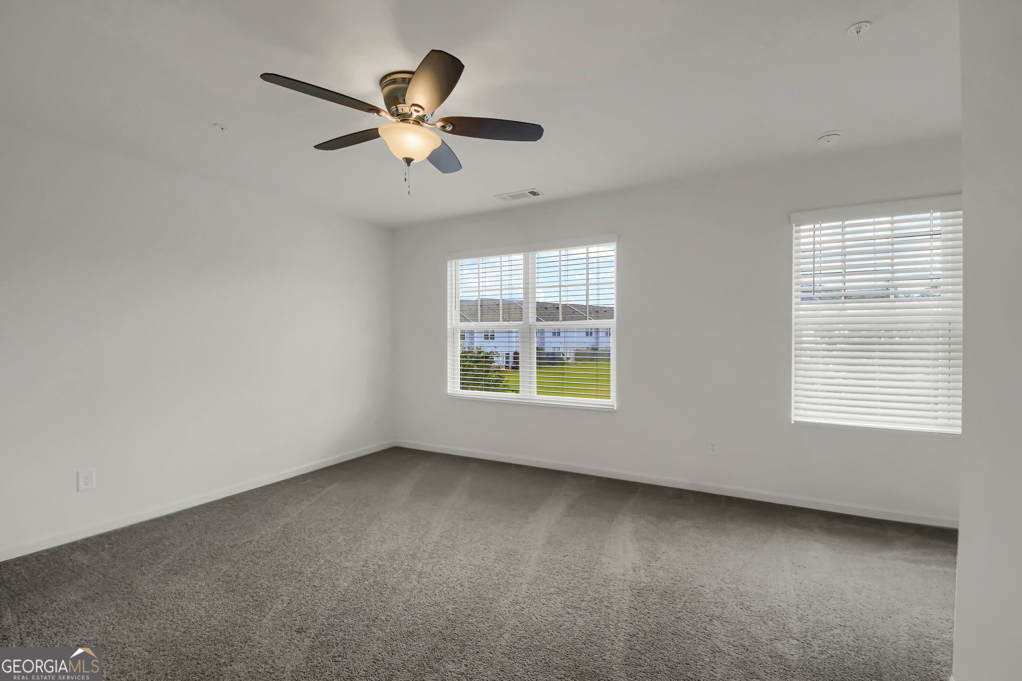 11924 Fuller Street Hampton, GA 30228 - Photo 20 of 26 a view of an empty room with a window