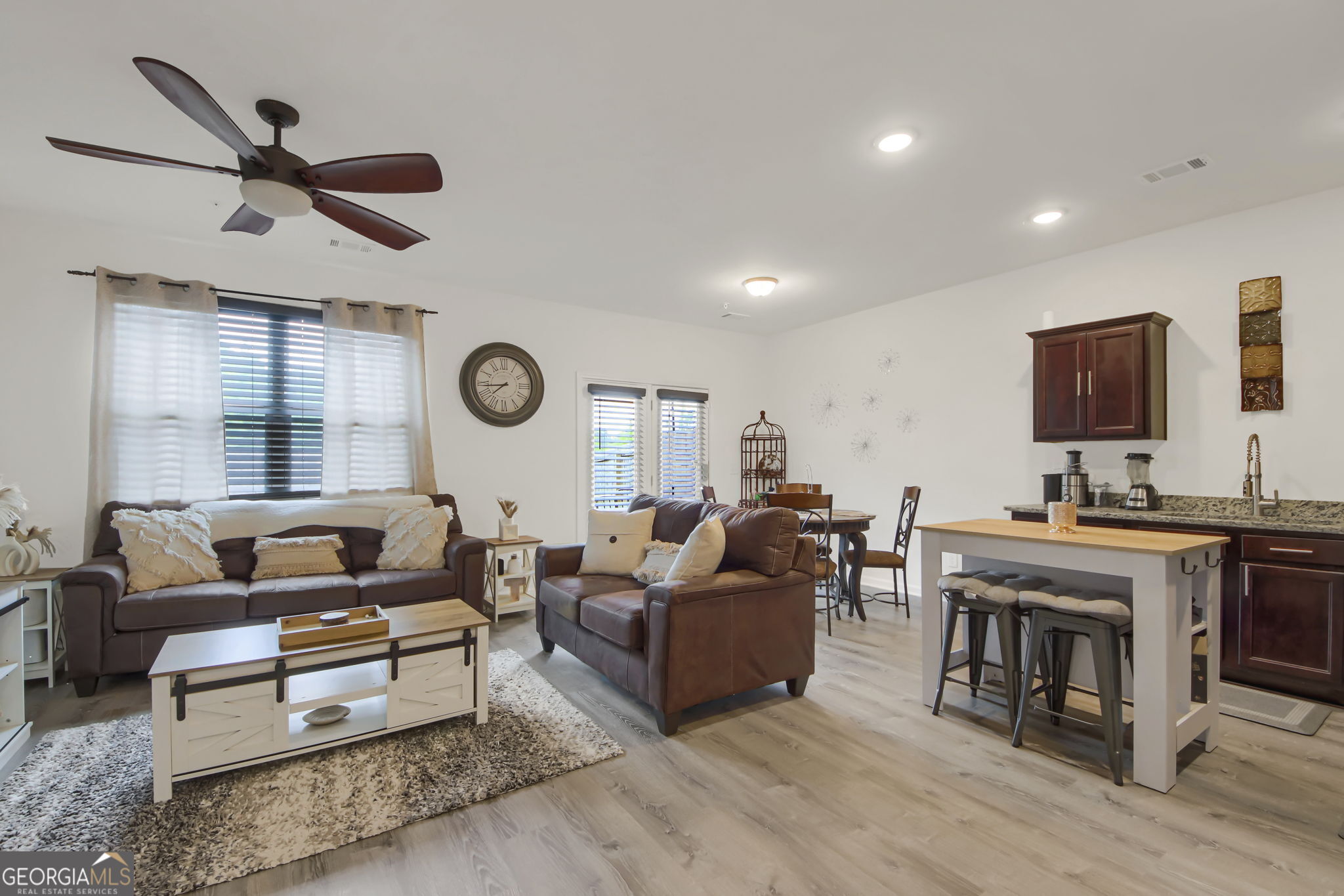 11924 Fuller Street Hampton, GA 30228 - Photo 5 of 26 a living room with furniture and a flat screen tv