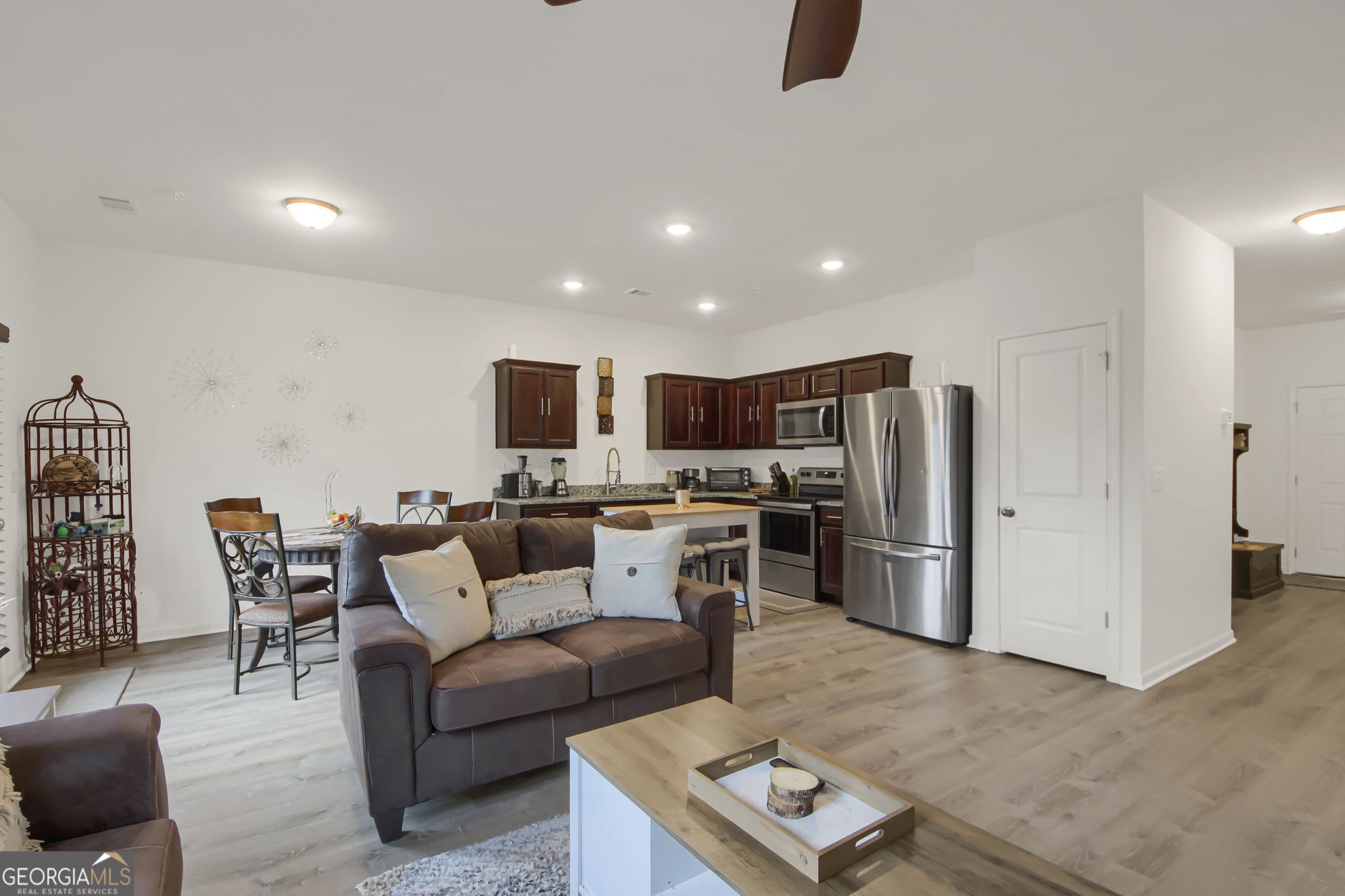 11924 Fuller Street Hampton, GA 30228 - Photo 8 of 26 a living room with furniture and a flat screen tv
