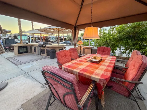 a outdoor dining space with furniture and outdoor view