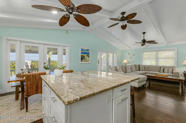 a dining table with chairs and window
