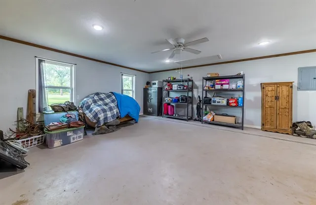 a bed room with furniture and a gym
