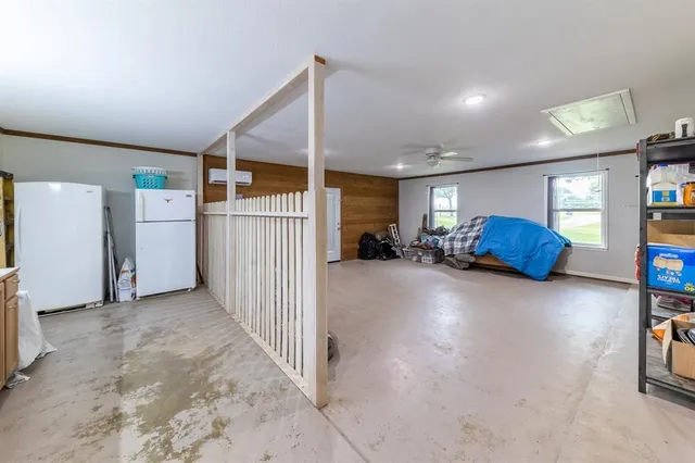 a view of living room and bedroom with furniture