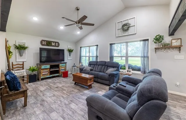 a living room with furniture and a flat screen tv