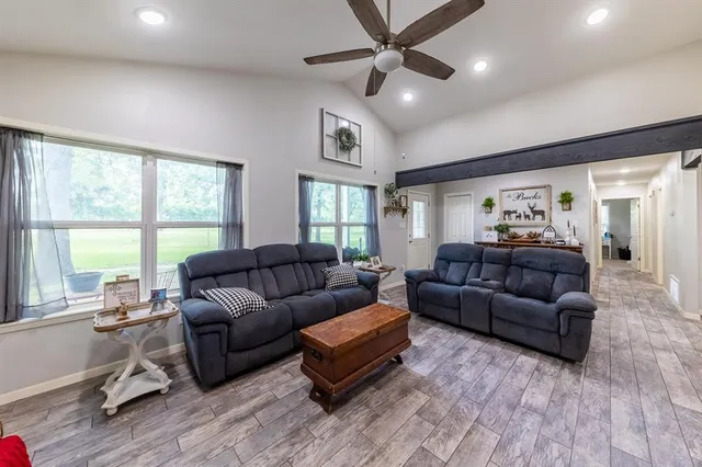 a living room with furniture and a large window