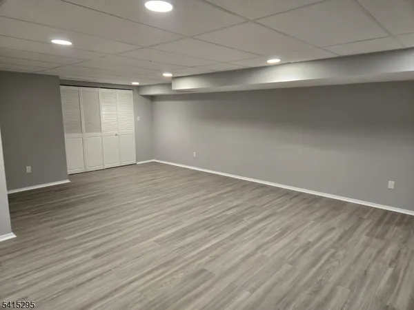 an empty room with wooden floor
