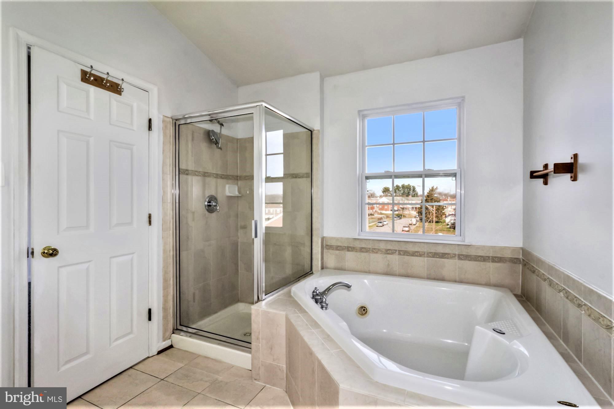 9840 Decatur Road Baltimore, MD 21220 - Photo 20 of 28 Ensuite Primary Bathroom with Jetted Tub & Shower