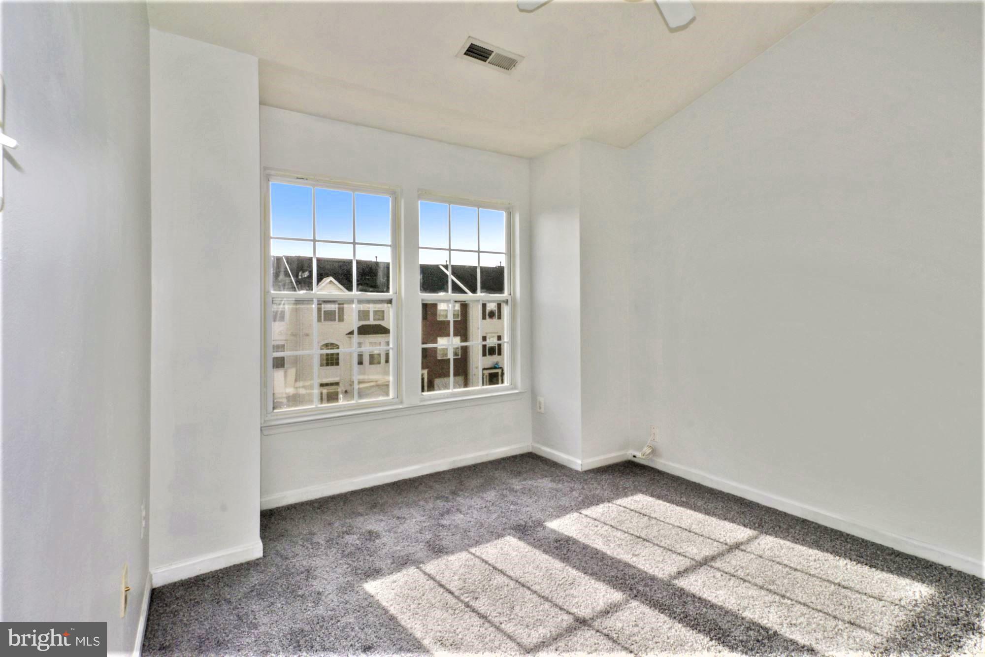 9840 Decatur Road Baltimore, MD 21220 - Photo 21 of 28 Bedroom 2 with big windows, new carpet
