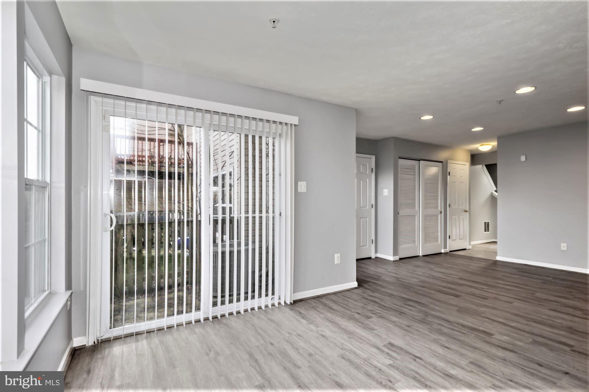 9840 Decatur Road Baltimore, MD 21220 - Photo 4 of 28 Lower Level Great Room view of SGD to Patio