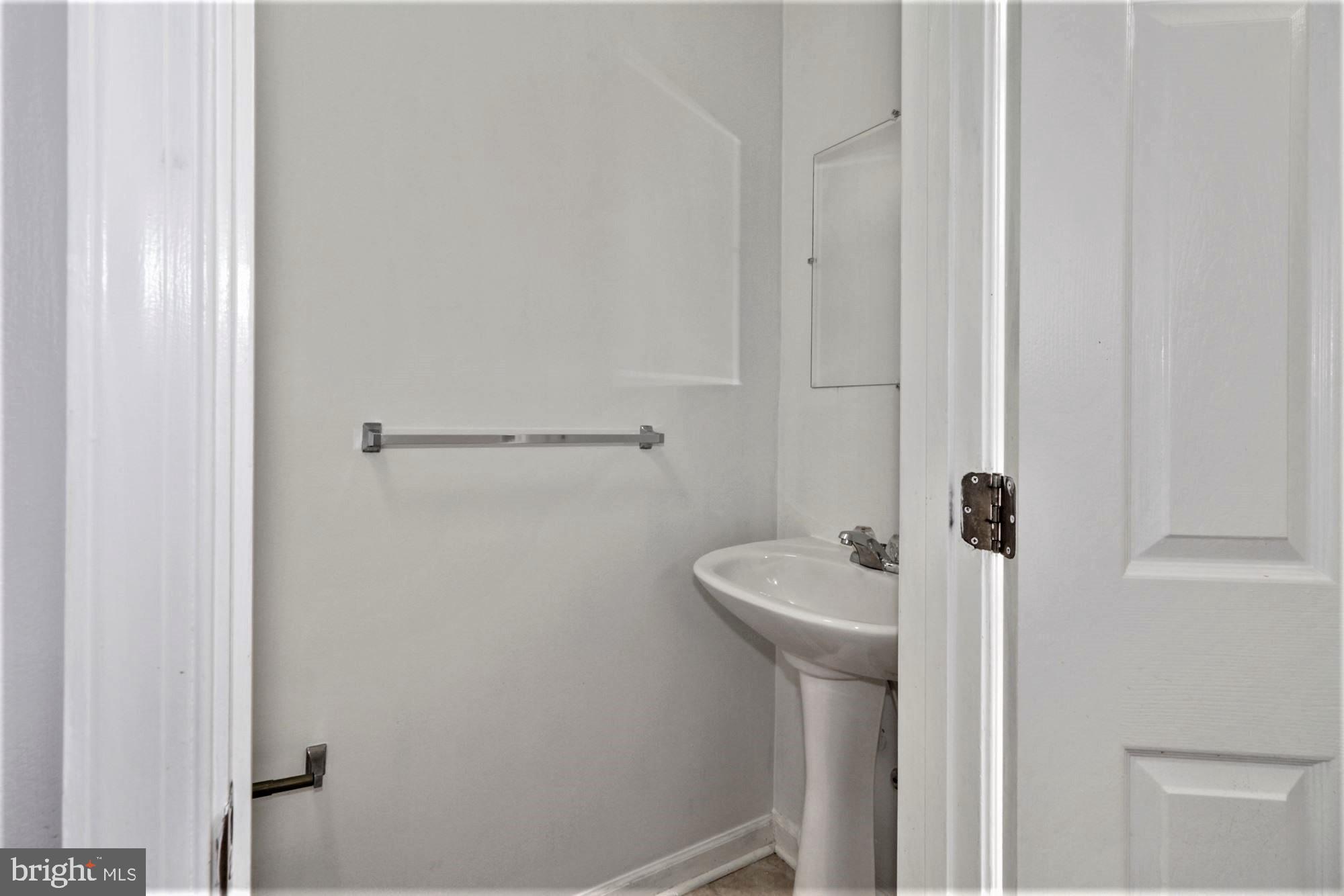 9840 Decatur Road Baltimore, MD 21220 - Photo 7 of 28 Half Bathroom in Lower Level hallway