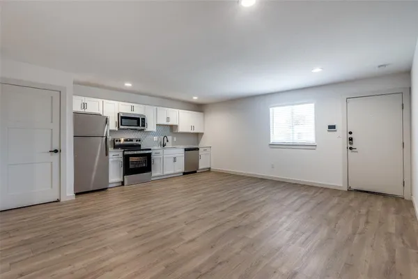 a view of kitchen with wooden floor