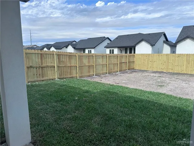 a view of pool with a small yard and a small yard