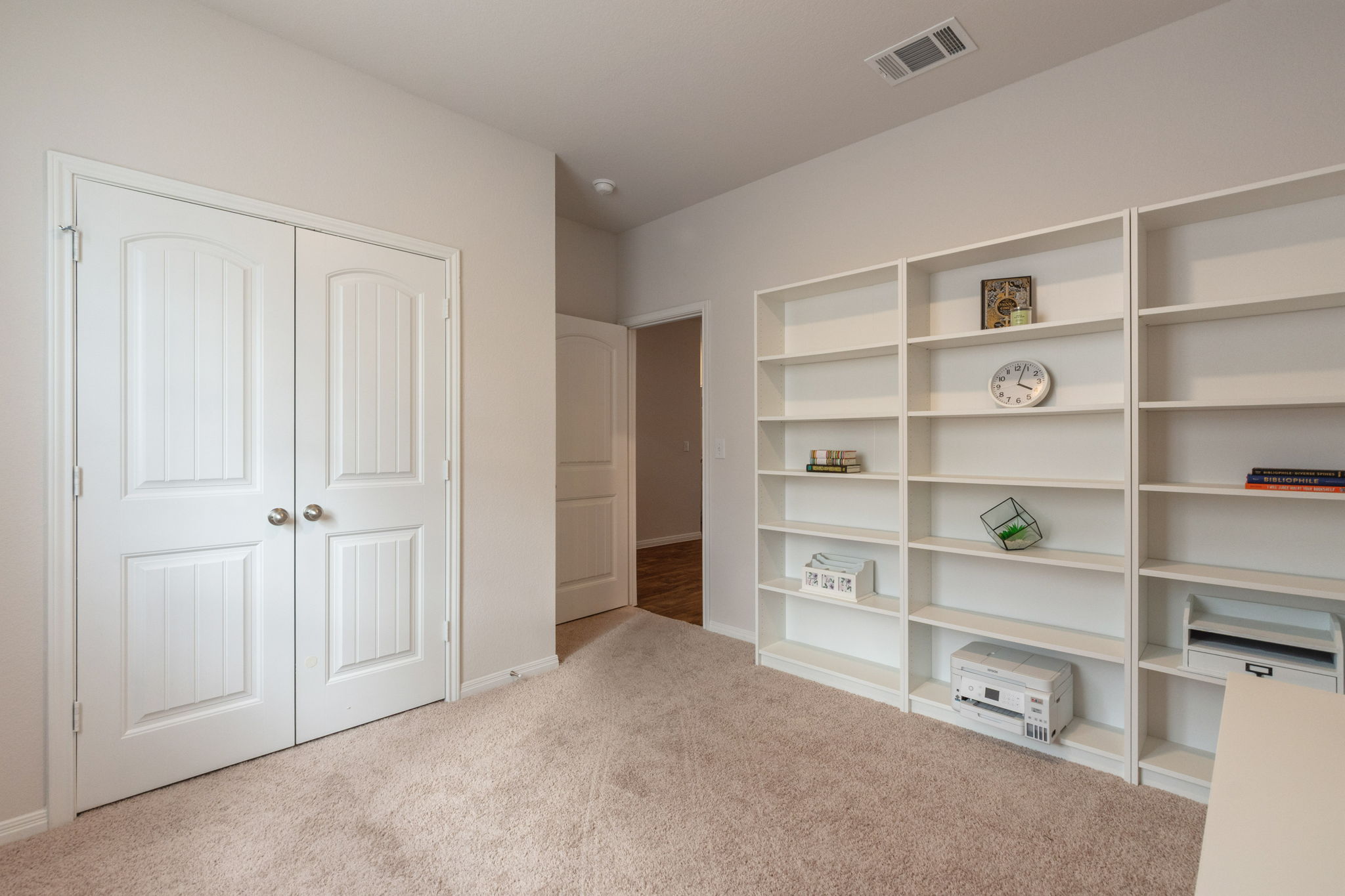 205 Charles Trail Georgetown, TX 78626 - Photo 14 of 36 Unfurnished bedroom with light colored carpet and a closet