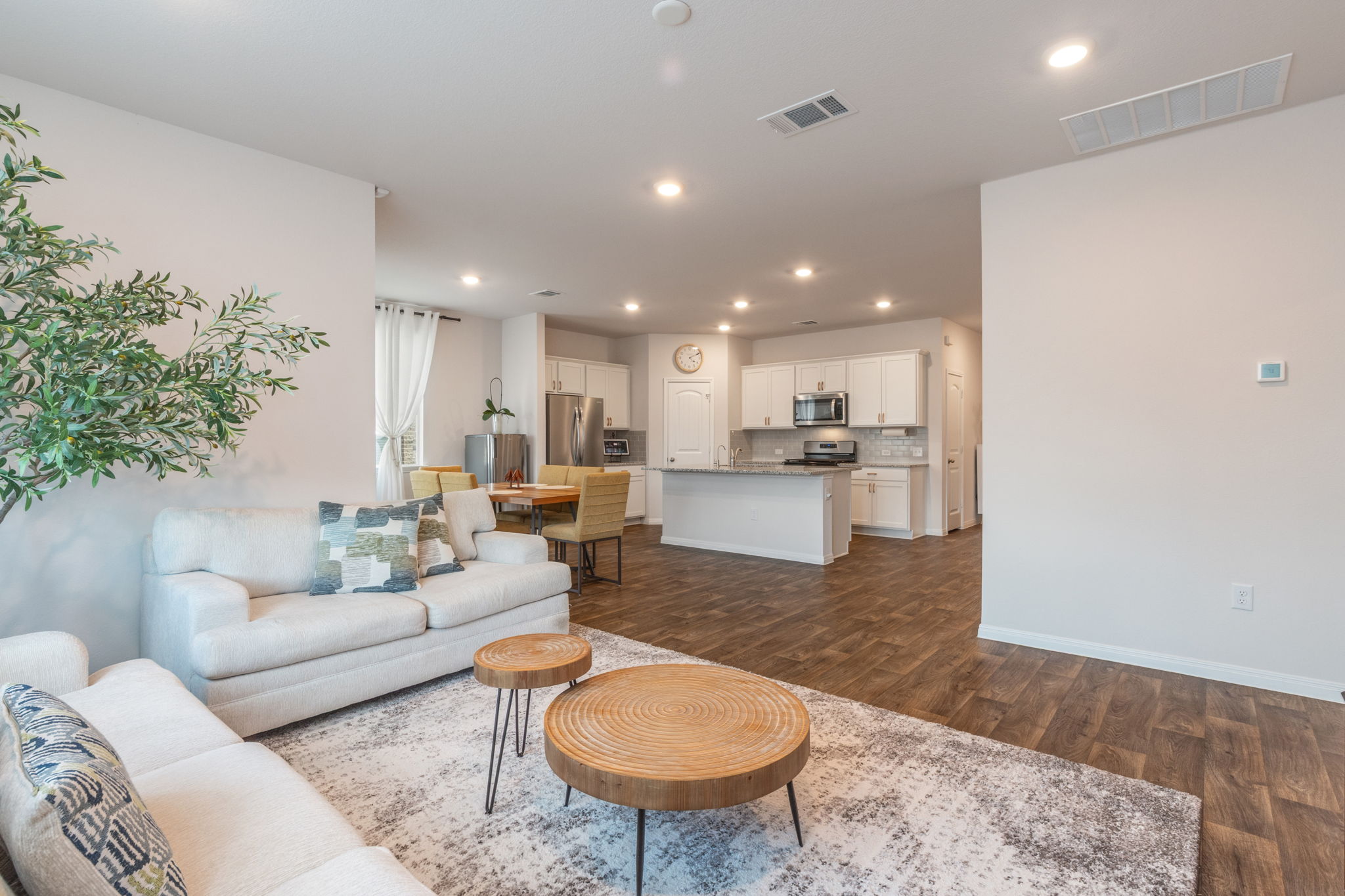 205 Charles Trail Georgetown, TX 78626 - Photo 2 of 36 Living room featuring dark wood-type flooring and recessed lighting