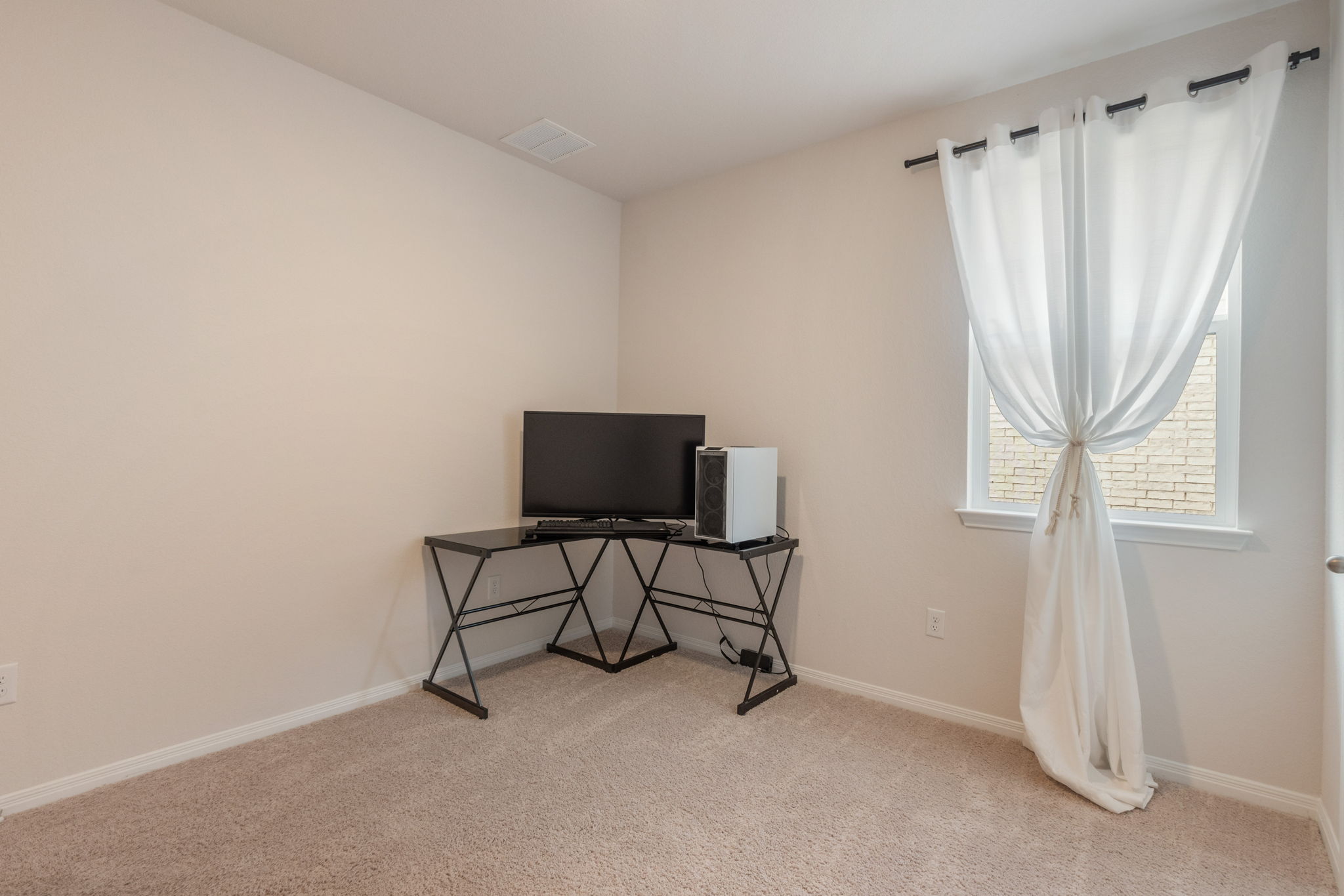 205 Charles Trail Georgetown, TX 78626 - Photo 22 of 36 Bedroom with light carpet and baseboards