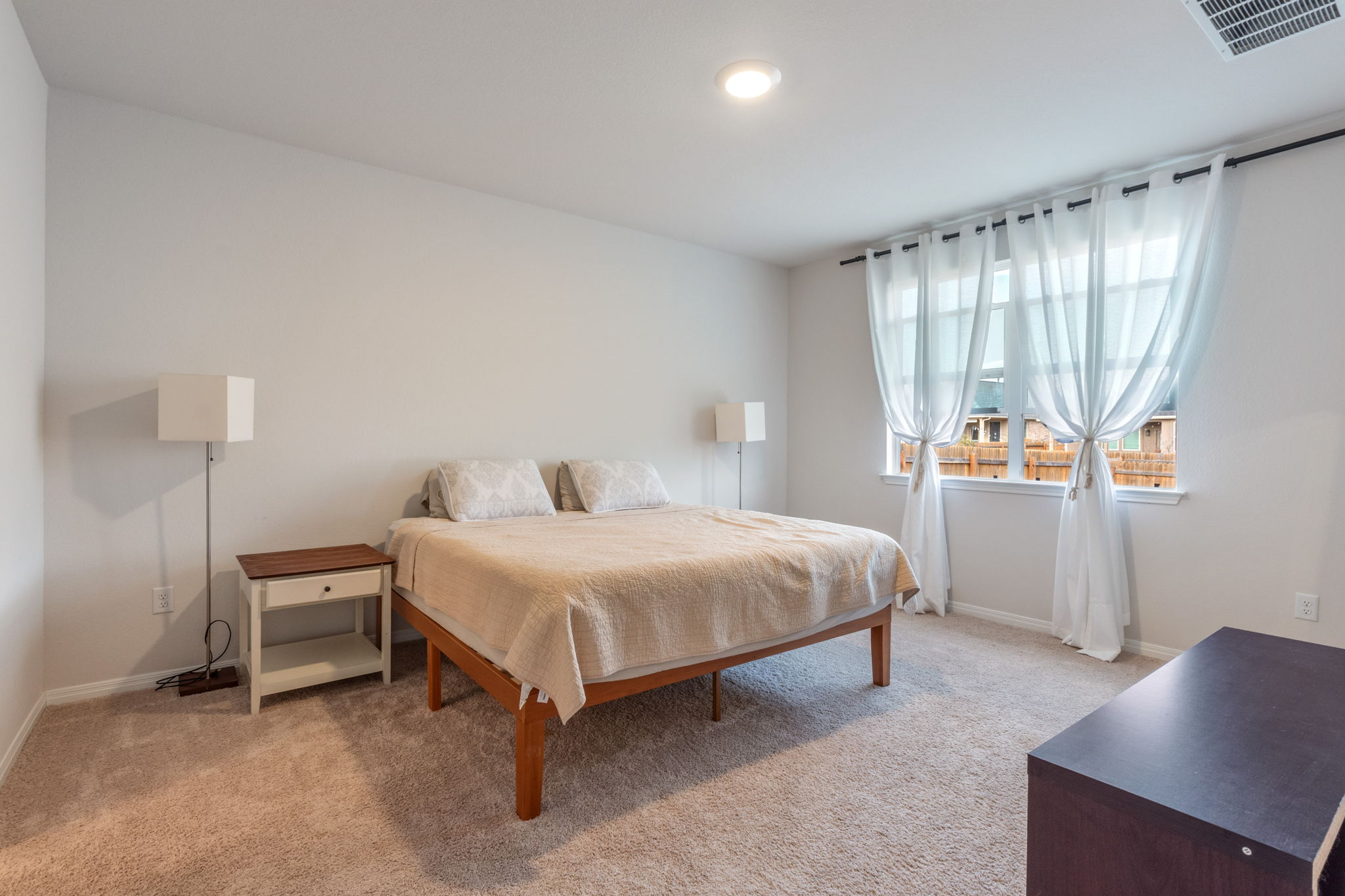 205 Charles Trail Georgetown, TX 78626 - Photo 23 of 36 Bedroom with light colored carpet and baseboards